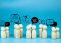 peg doll with message notification icon, chat social media interaction.